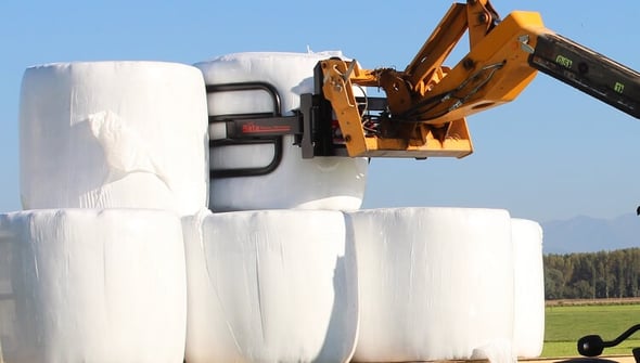 Soft Hands Bale Clamp moving wrapped silage bales
