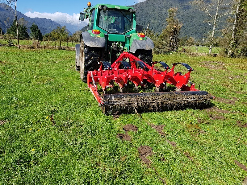 Rata Auto Reset Panerazer soil aerator behind John Deere Tractor