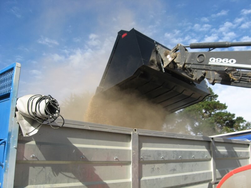 Rata bucket on tractor front end loader handling grain