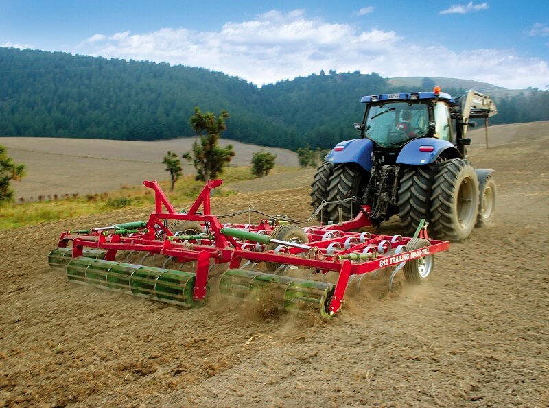 Rata 812 Trailing Maxitill behind New Holland Tractor