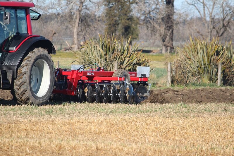 Rata Offset Plough Discs behind Valtra tractor