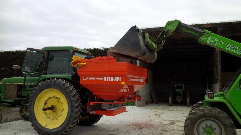 KYLO fertiliser spreader being loaded with a bucket