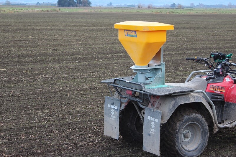 Vogal slug bait spreader mounted on atv ready to spread bait over a paddock