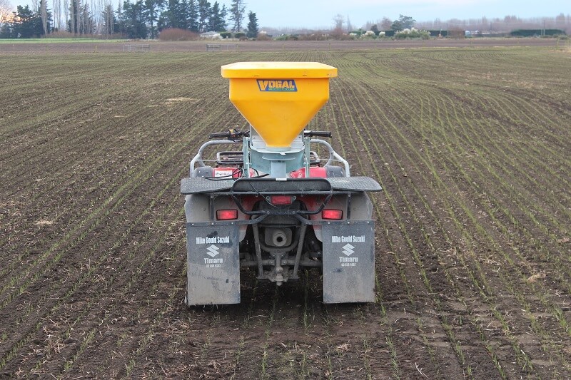 Vogal Baitmax slug bait spreader mounted on a Suzuki quad bike in a paddock