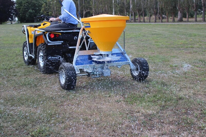 Spreading fertiliser behind quad bike with Vogal EX120 spreader - Rata Equipment - Rata Industries