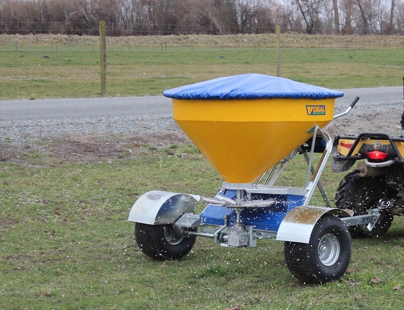 Vogal EX500 fertiliser spreading behind a quad bike in a paddock