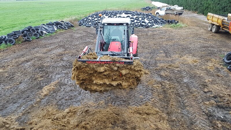 Rata Silage Grab holding stack silage on Massy Ferguson tractor